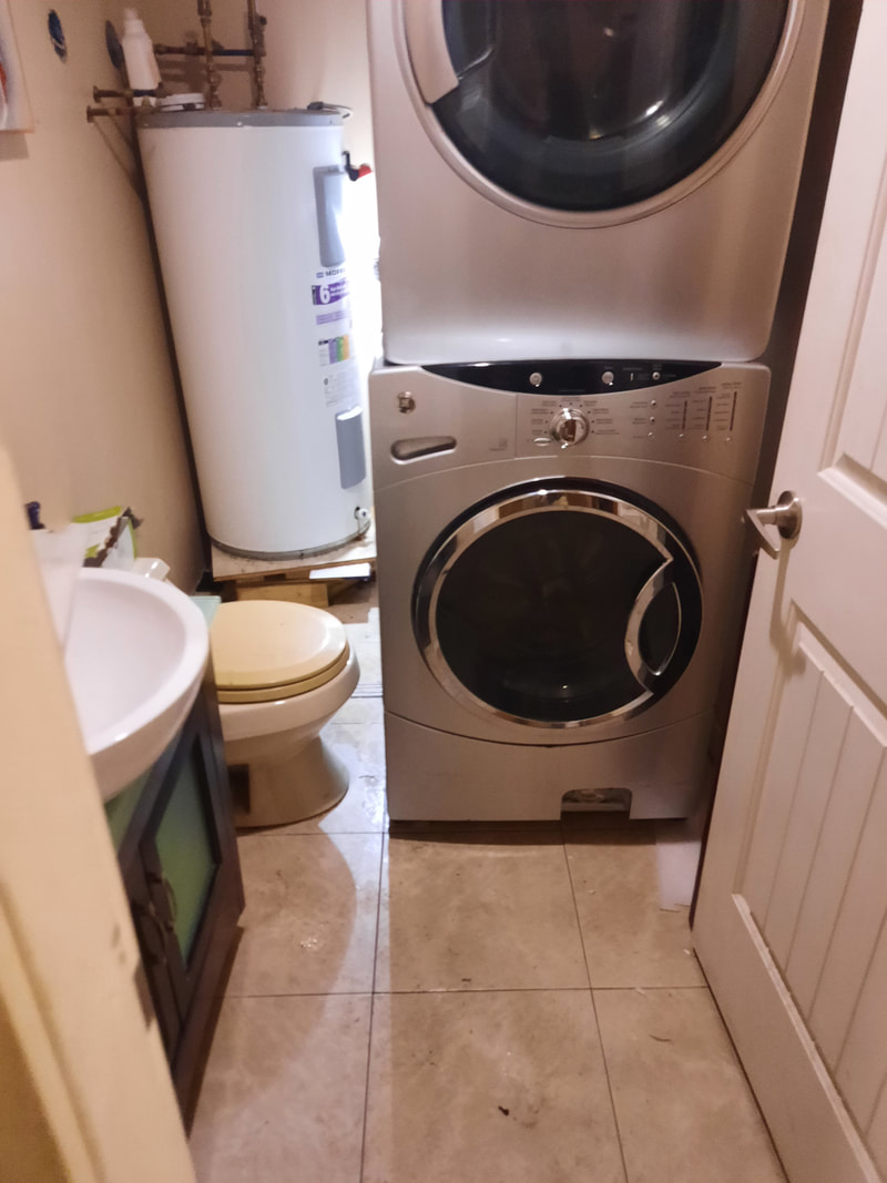 washing machine with water all over the floor